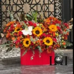 باکس گل آفتابگردان BL171 شامل آفتابگردان، رز مینیاتوری و ارکیده – ابعاد ارتفاع ۶۰ عرض ۶۰ سانتی‌متر – گل فروشی لونا فلاور کرج